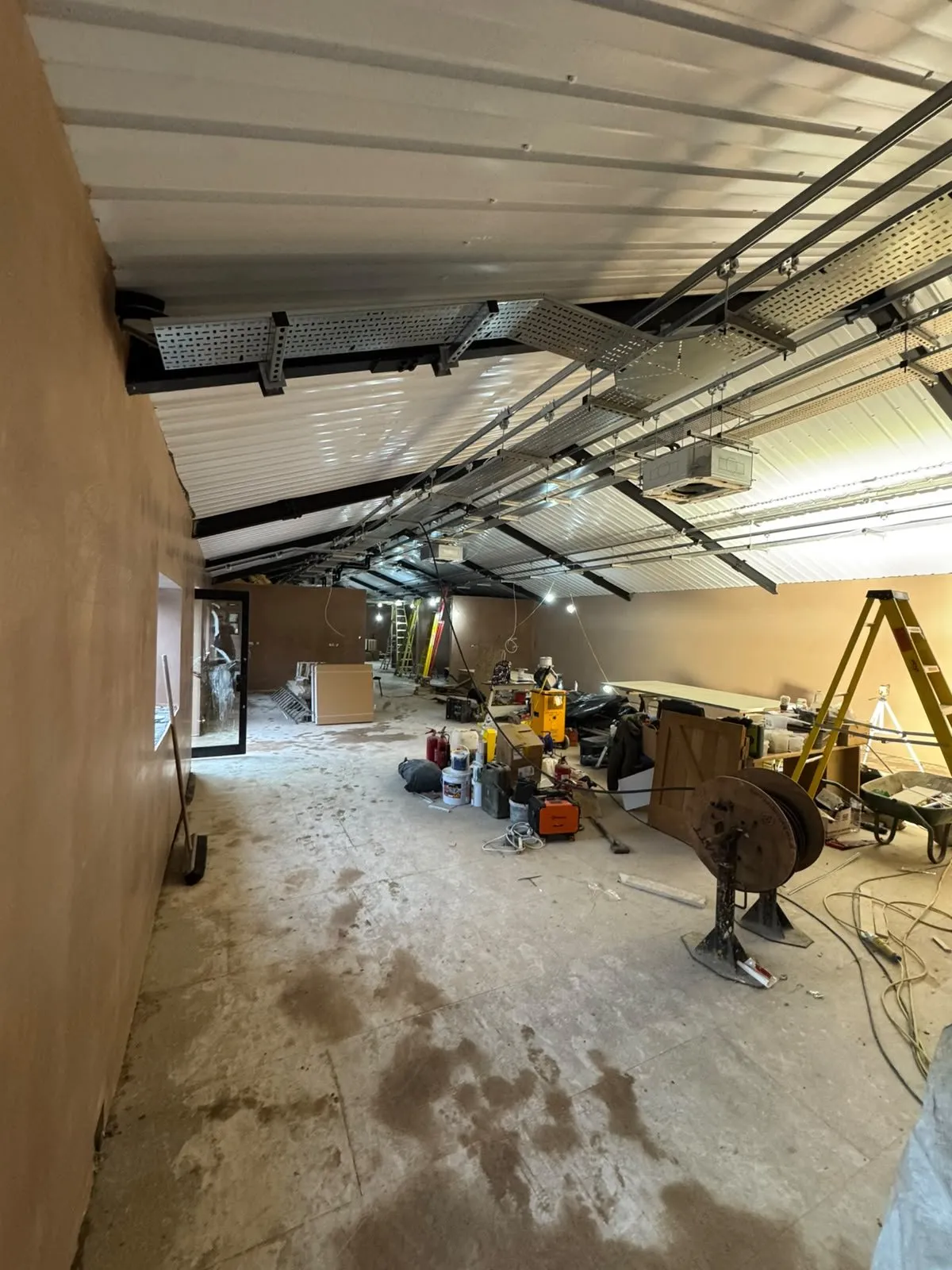 Large open-plan extension being plastered